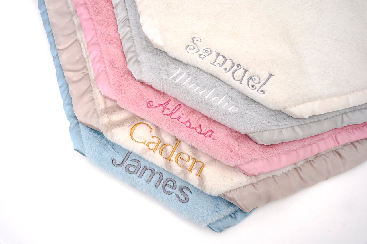 Soft embroidery baby blankets in a variety of colors.