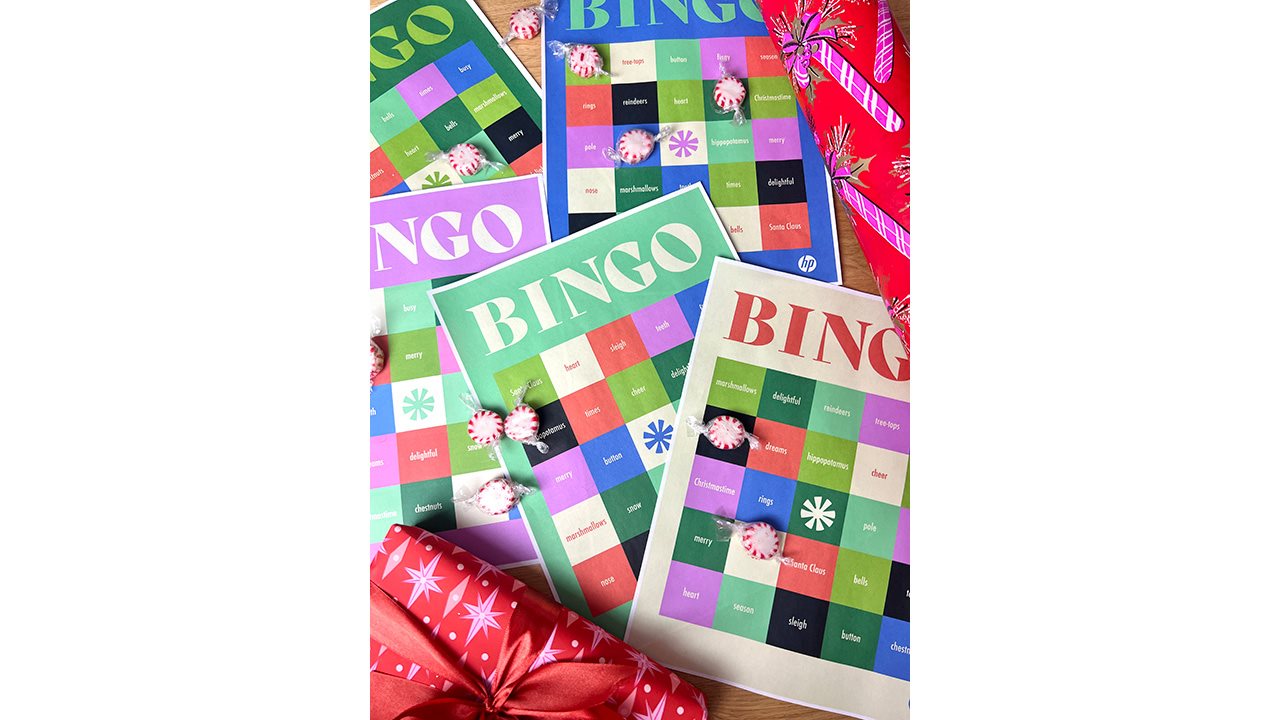 Printed holiday-themed bingo cards covered with presents and peppermints