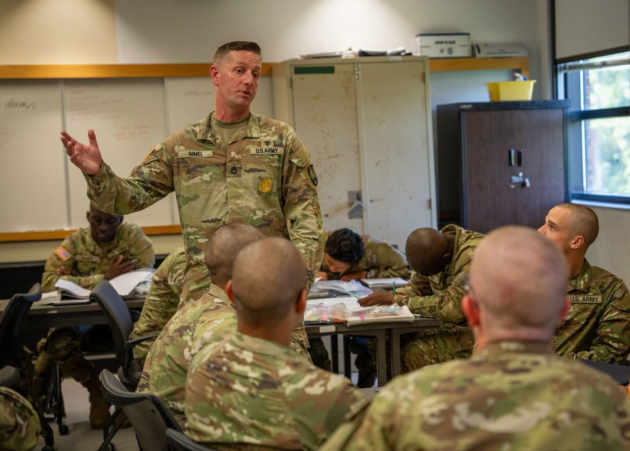 1st Sgt. Eric Immel training students in the classroom.