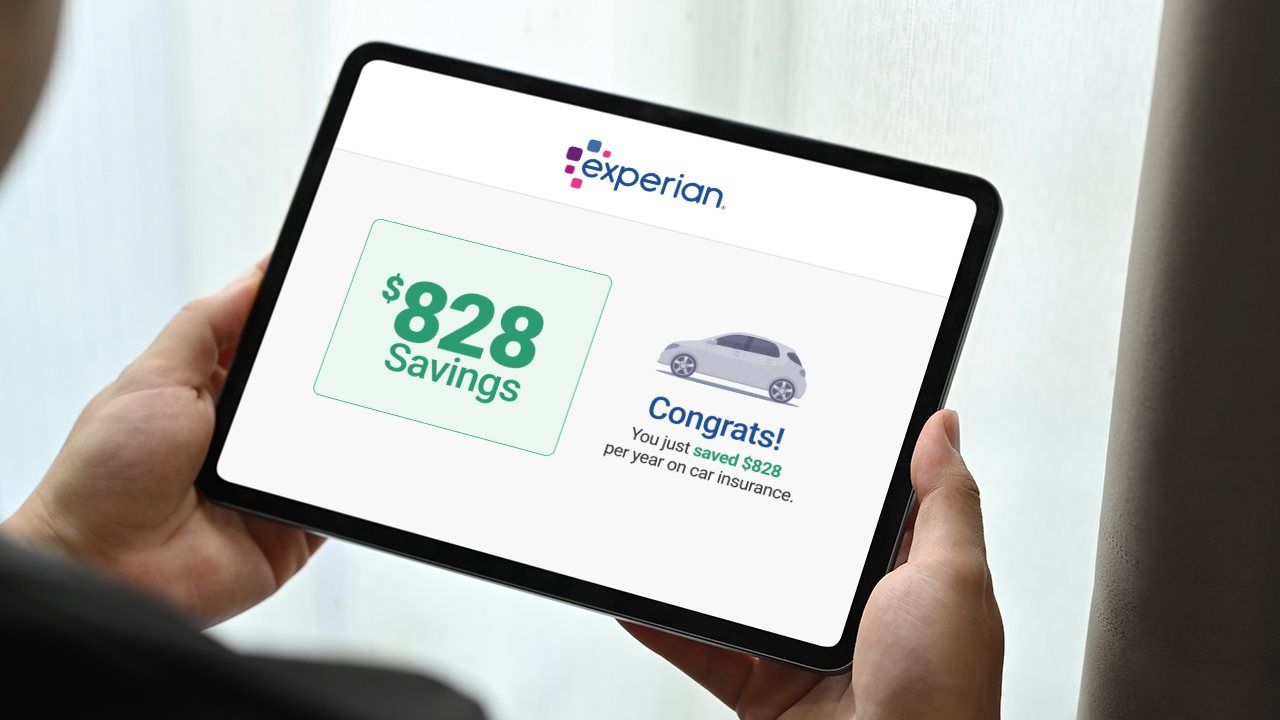 Man holding a tablet which displays an Experian app.