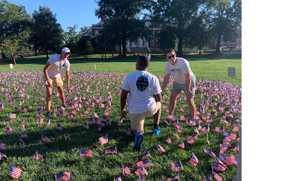 Group of volunteers placing flags for a AmeriCorp 9-11 day of service event.