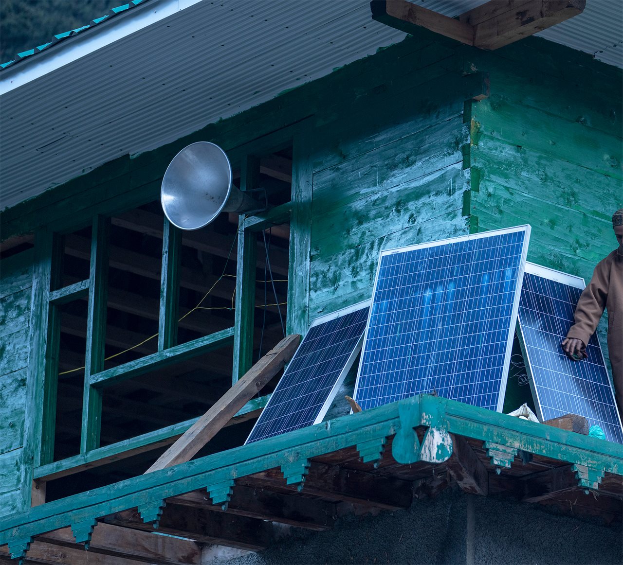 Solar panels leaning against a building