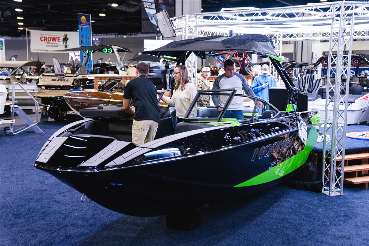 Close up of a family on a boat at a boat show.