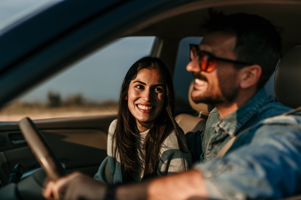 Couple on a road trip taking turns driving.