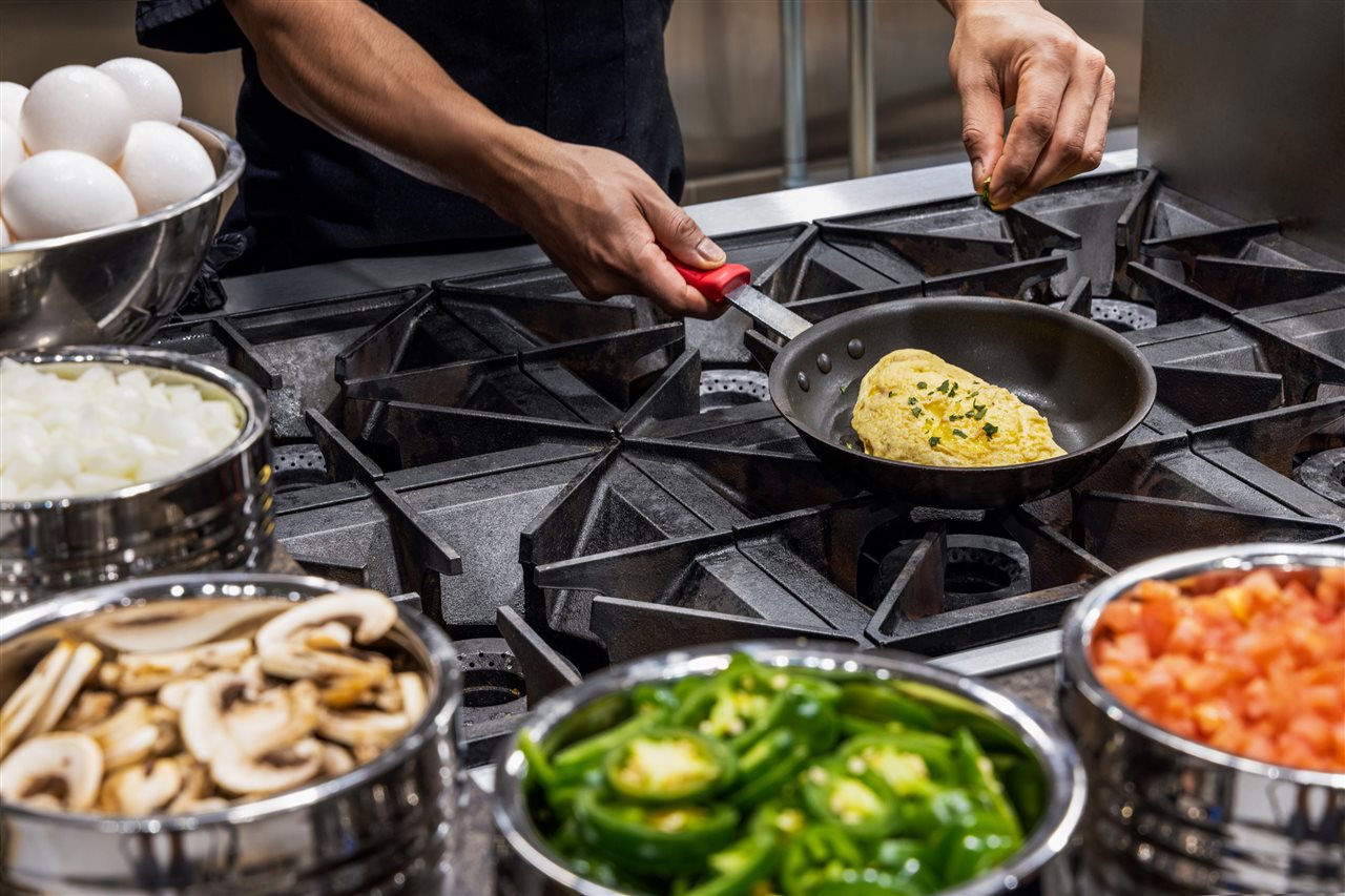 Expansive Omelette station at the Hilton featuring: eggs, peppers, onions and mushrooms.