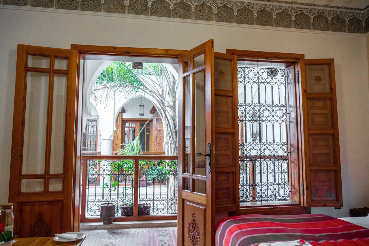 Stunning hotel room in Morocco featuring lavash carved wood and iron work.