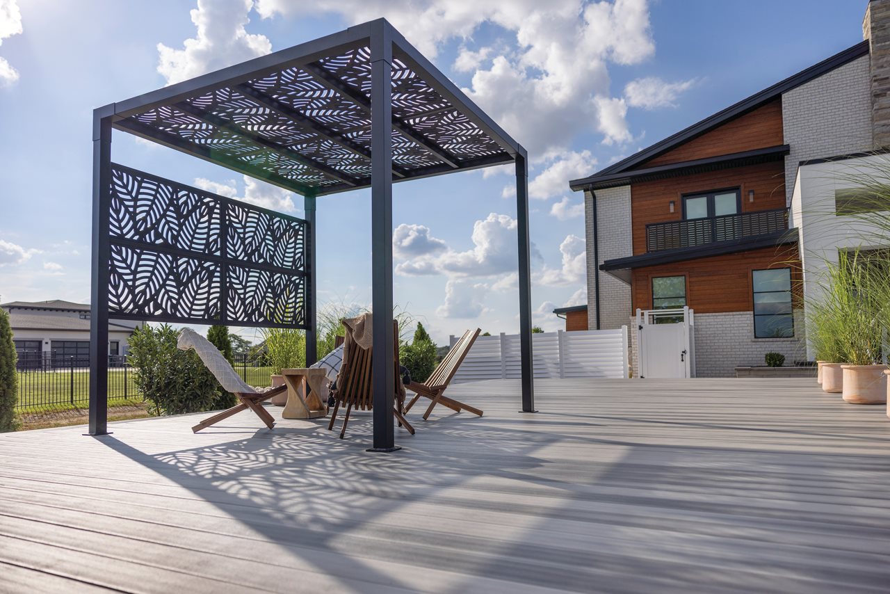 Back yard oasis with shade feature on patio.