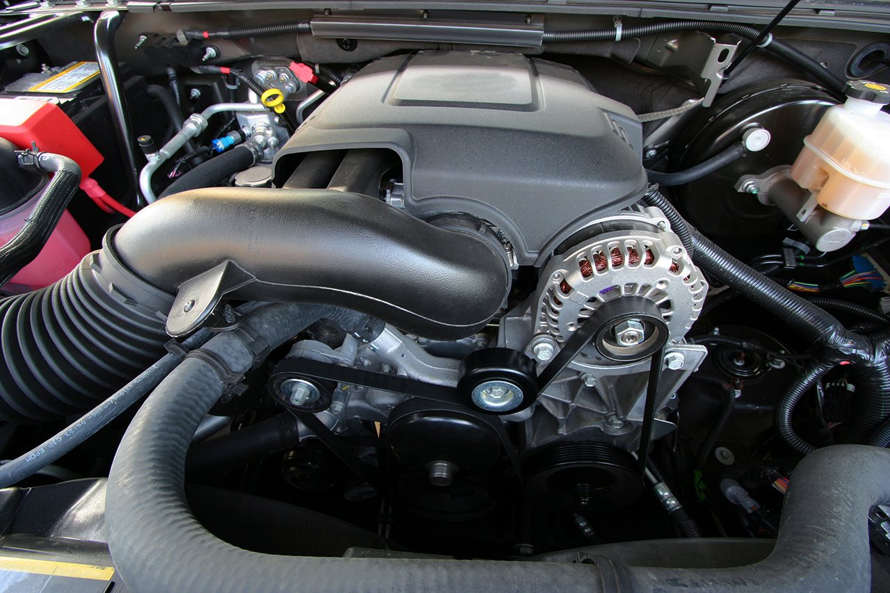 An engine under the hood of a car,