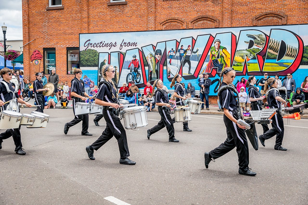 Youth marching band walks down street